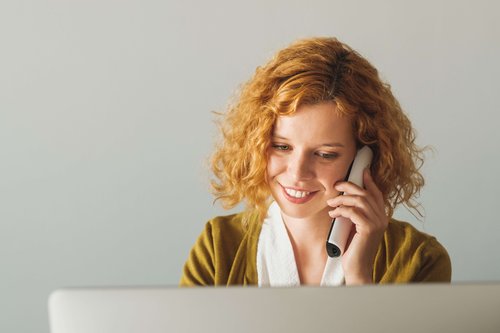 Businesswoman Speaking On The Phone At The Office