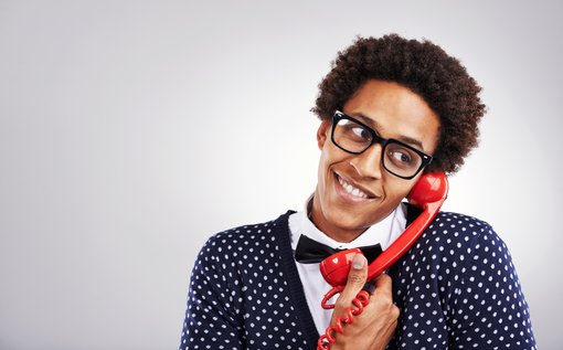 Studio shot of a young man talking on an old telephonehttp://195.154.178.81/DATA/i_collage/pu/shoots/805791.jpg
