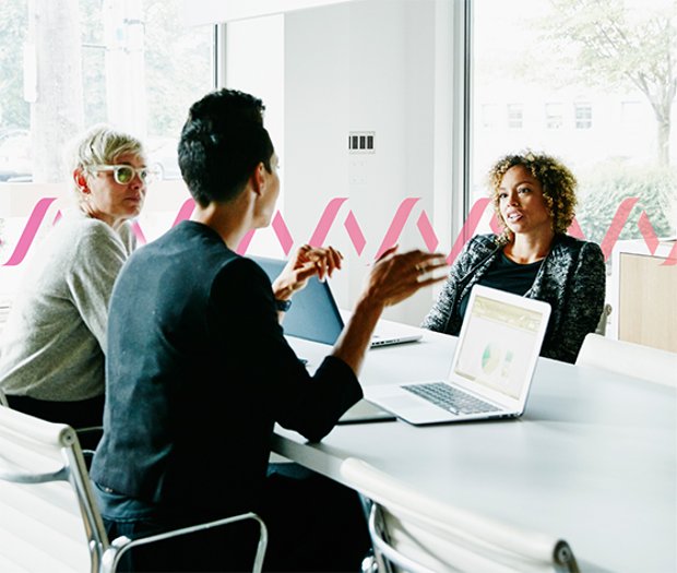 Photoillustration of three people talking in a conference room