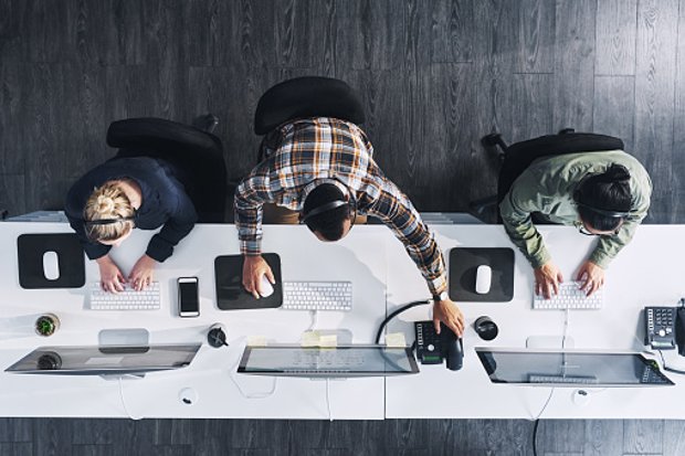 High angle shot of a group of call centre agents working in an office